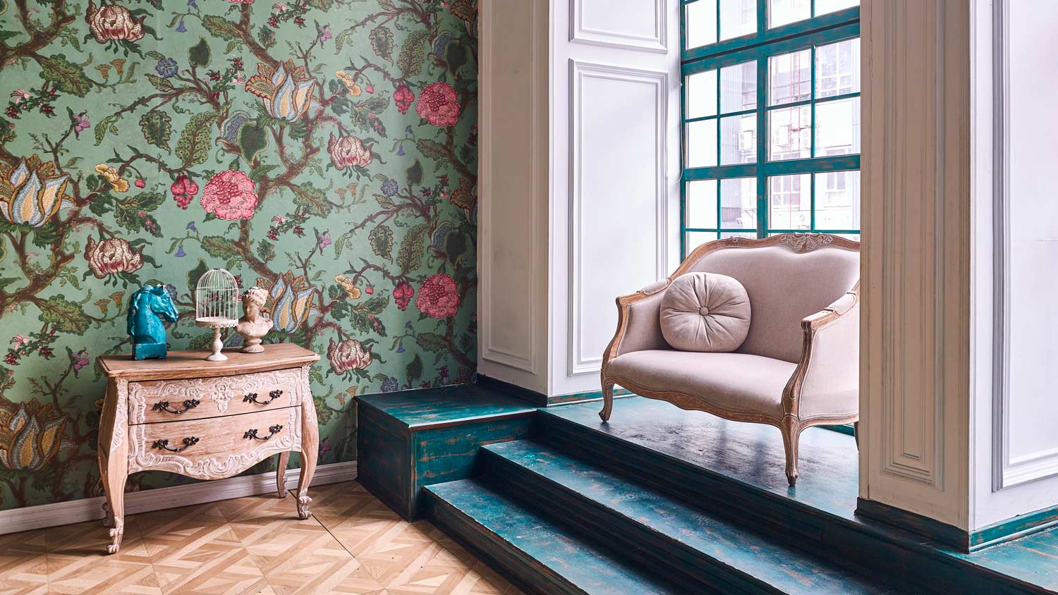 The interior of a loft with a floral wallpaper